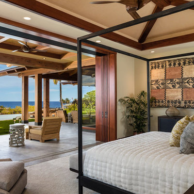 Inspiration for a tropical bedroom remodel in Hawaii with beige walls