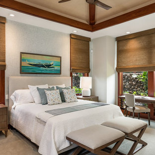 Foto de dormitorio tropical con paredes blancas, moqueta y suelo gris
