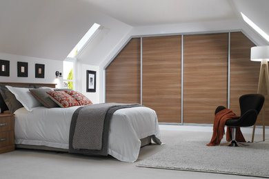 Inspiration for a medium sized contemporary guest bedroom in London with white walls, carpet and grey floors.