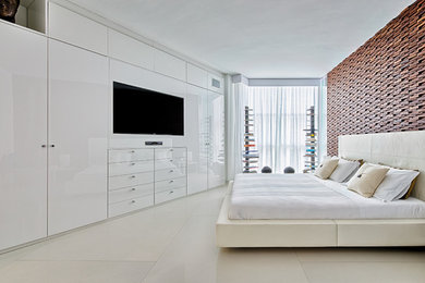 Cette image montre une chambre parentale design de taille moyenne avec un mur blanc et sol en béton ciré.