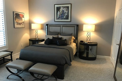Mid-sized guest carpeted bedroom photo in Orlando with gray walls and no fireplace