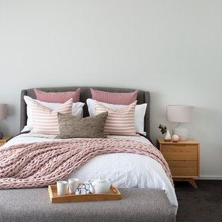 Scandinavian bedroom in Brisbane with white walls, carpet and black floor.