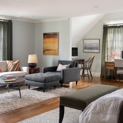 Mid-sized transitional master medium tone wood floor and brown floor bedroom photo in Boston with gray walls and no fireplace