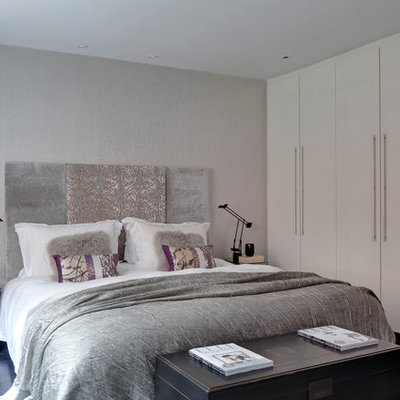 Inspiration for a small contemporary master dark wood floor bedroom remodel in London with gray walls