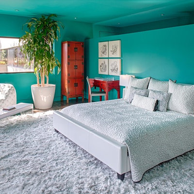 Inspiration for a contemporary dark wood floor bedroom remodel in Austin with blue walls and no fireplace