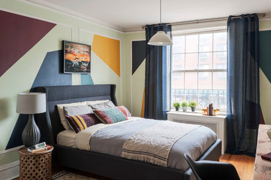 Bedroom - mid-sized eclectic master medium tone wood floor bedroom idea in New York with multicolored walls