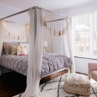 Cottage chic dark wood floor bedroom photo in Chicago with white walls