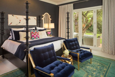 Example of a transitional master carpeted bedroom design in Austin with black walls