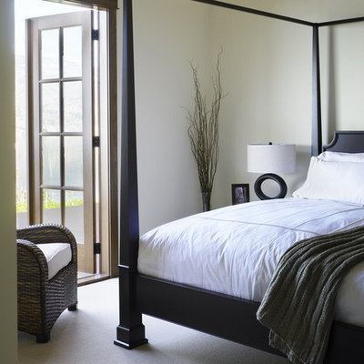 Example of a trendy carpeted bedroom design in Vancouver with beige walls