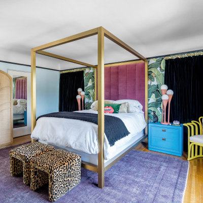 Inspiration for a mid-sized eclectic master medium tone wood floor and wallpaper bedroom remodel in Los Angeles with multicolored walls and no fireplace