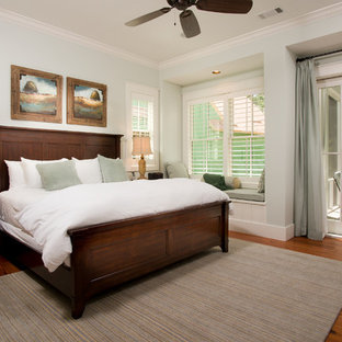 Bedroom - small farmhouse master medium tone wood floor bedroom idea in Atlanta with blue walls