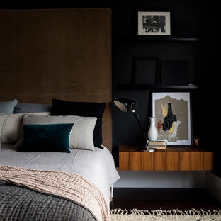 Photo of a medium sized contemporary master bedroom in London with black walls.