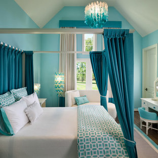 Transitional dark wood floor bedroom photo in Houston with blue walls
