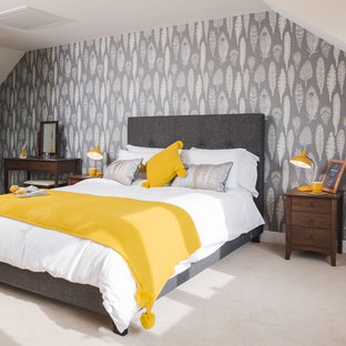 This is an example of a medium sized classic guest bedroom in Gloucestershire with carpet, beige floors and white walls.