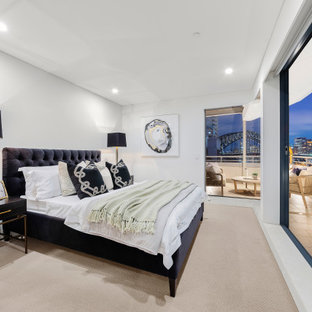 Inspiration for a contemporary bedroom in Sydney with white walls, carpet and beige floor.