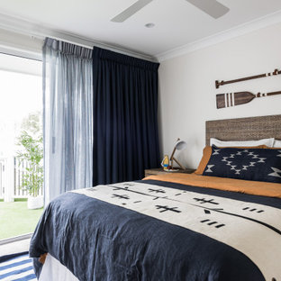 Beach style bedroom in Gold Coast - Tweed with grey walls, carpet and grey floor.