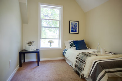 Bedroom - small transitional guest carpeted bedroom idea in Other with beige walls and no fireplace