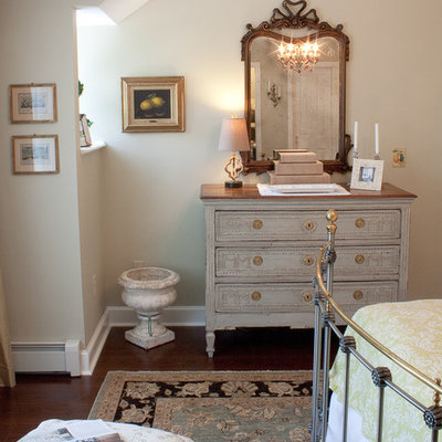 Inspiration for a timeless dark wood floor bedroom remodel in Boston with beige walls