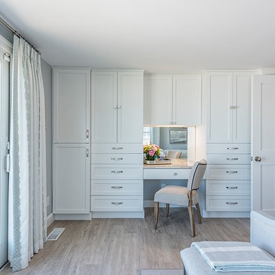 Large beach style master light wood floor and beige floor bedroom photo in Boston with gray walls and no fireplace