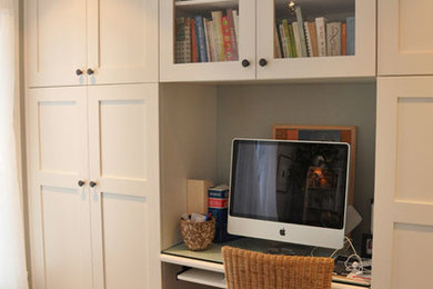 Example of a transitional home office design in Montreal