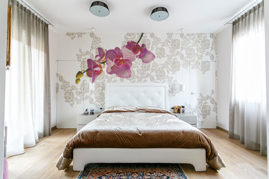 Medium sized modern master bedroom in Milan.
