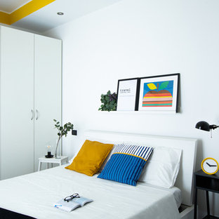 Idee per una camera da letto contemporanea con pareti bianche