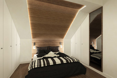 Imagen de dormitorio principal minimalista pequeño con suelo de madera clara, madera y panelado