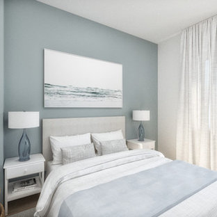 Foto de dormitorio principal, romántico, pequeño, con paredes azules, suelo de baldosas de cerámica y suelo multicolor