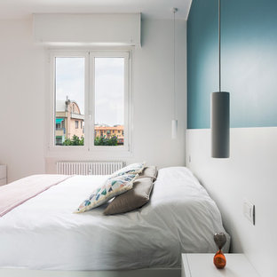 Foto di una piccola camera matrimoniale minimal con pareti blu