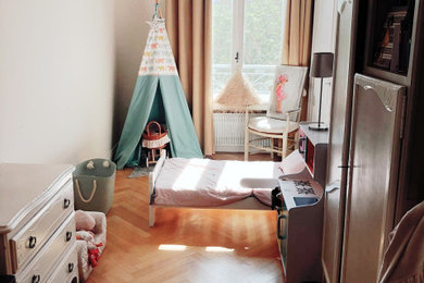 Design ideas for a medium sized contemporary toddler’s room for girls in Lyon with beige walls.