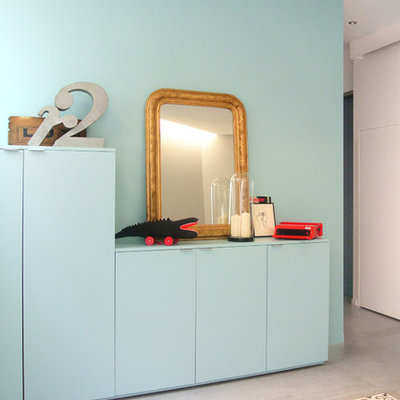 Childrens' room - mid-sized contemporary gender-neutral concrete floor childrens' room idea in Lyon with blue walls