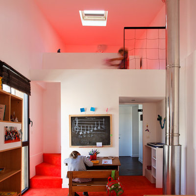 Kids' room - large contemporary gender-neutral carpeted kids' room idea in Paris with white walls