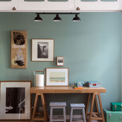 Kids' room - mid-sized contemporary gender-neutral medium tone wood floor and brown floor kids' room idea in Paris with green walls