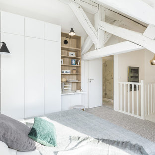 Réalisation d'une chambre nordique de taille moyenne avec un mur blanc, un sol gris et aucune cheminée.
