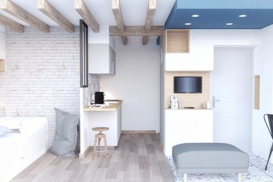 Modelo de dormitorio nórdico de tamaño medio sin chimenea con paredes blancas, suelo de madera clara y suelo marrón
