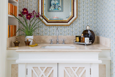 ケントにあるトランジショナルスタイルのおしゃれなトイレ・洗面所 (家具調キャビネット、白いキャビネット、マルチカラーの壁、アンダーカウンター洗面器、ベージュの床、ベージュのカウンター) の写真
