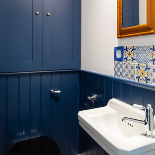 Inspiration for a victorian cloakroom in London with shaker cabinets.
