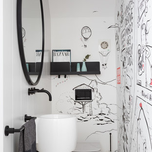 Medium sized contemporary cloakroom in London with a wall mounted toilet, white walls, marble flooring, a wall-mounted sink and grey floors.
