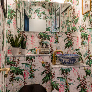 This is an example of a large bohemian cloakroom in London with flat-panel cabinets, a one-piece toilet, multi-coloured walls, medium hardwood flooring, tiled worktops, brown floors and a vessel sink.