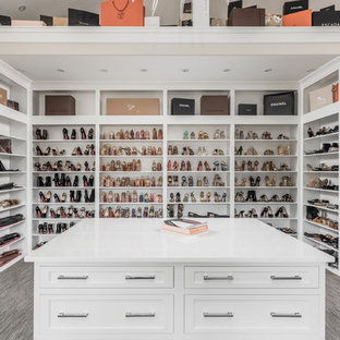 Example of a huge tuscan gender-neutral walk-in closet design in Indianapolis