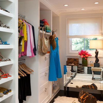 Inspiration for a mid-sized contemporary women's dark wood floor dressing room remodel in San Francisco with recessed-panel cabinets and white cabinets
