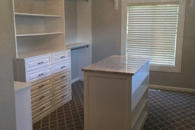 Walk-in closet - large shabby-chic style carpeted and gray floor walk-in closet idea in Boise with raised-panel cabinets and white cabinets