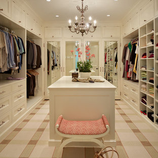 Example of a classic carpeted closet design in Seattle with beige cabinets