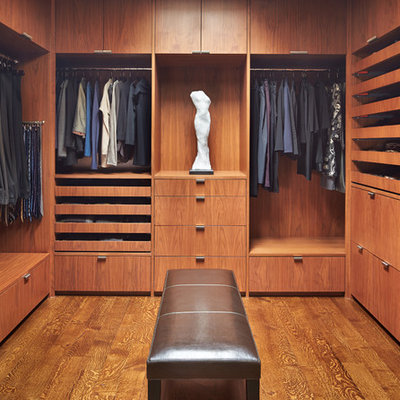 Large trendy men's medium tone wood floor dressing room photo in Seattle with flat-panel cabinets and medium tone wood cabinets