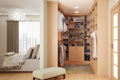 Imagen de armario vestidor unisex actual pequeño con armarios abiertos, puertas de armario de madera clara, suelo de madera clara y suelo beige