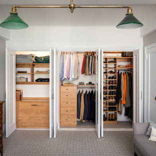 Transitional men's carpeted and gray floor dressing room photo in New York with flat-panel cabinets and medium tone wood cabinets