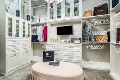 Example of a classic women's carpeted and gray floor dressing room design in Phoenix with recessed-panel cabinets and white cabinets