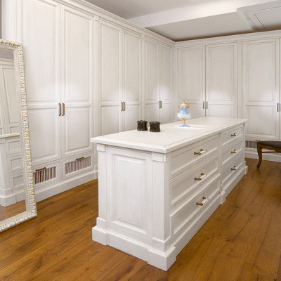 Trendy dressing room photo in Other with white cabinets