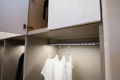 Example of a trendy closet design in Other