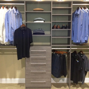 Small elegant gender-neutral reach-in closet photo in Jacksonville with gray cabinets